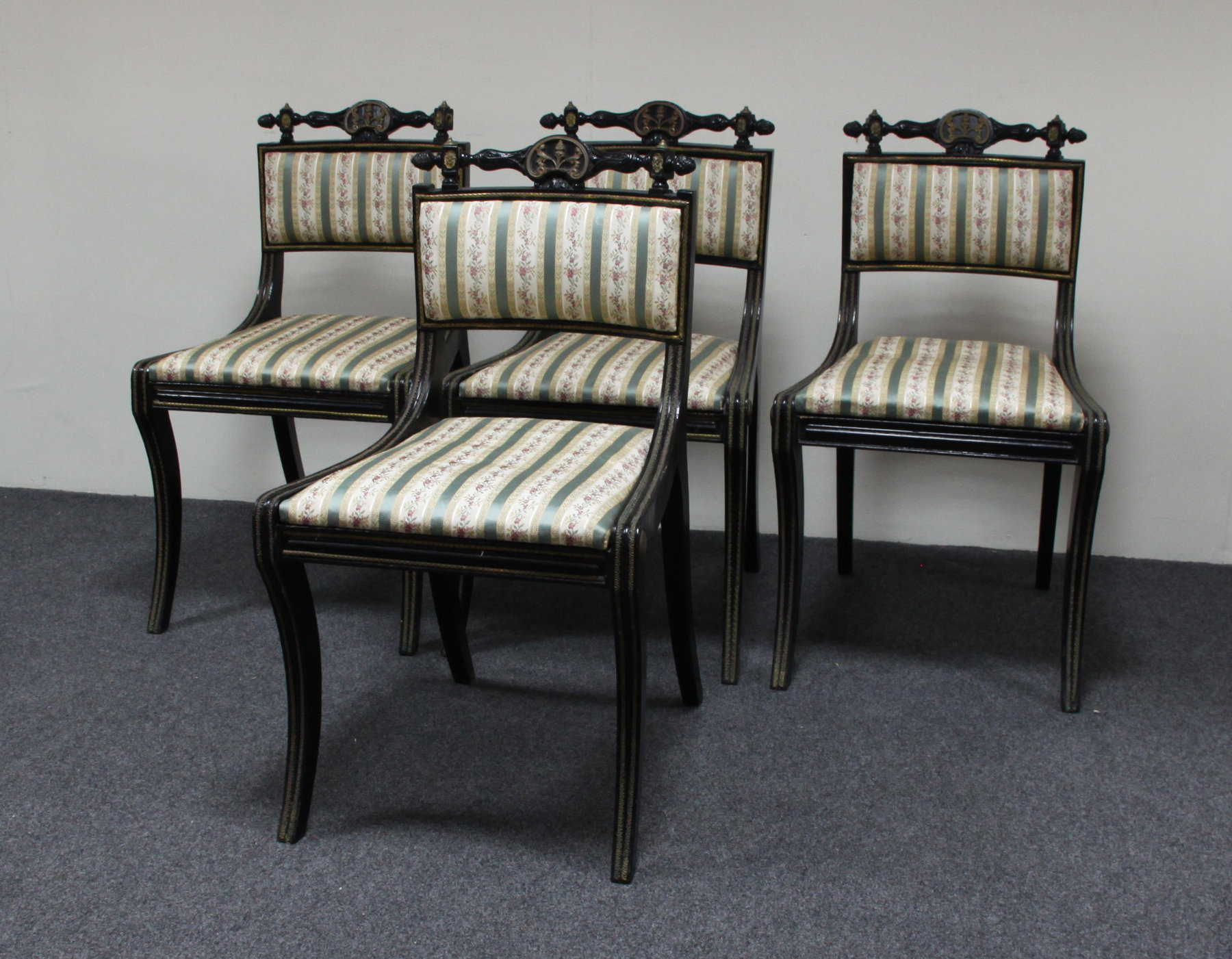 Appraisal: A set of four th Century ebonised dining chairs manner