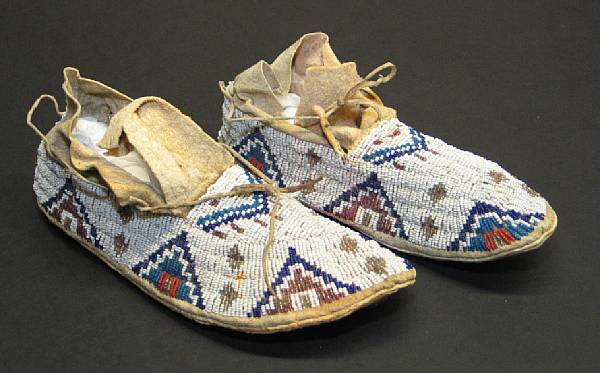 Appraisal: A pair of Sioux beaded moccasins length in