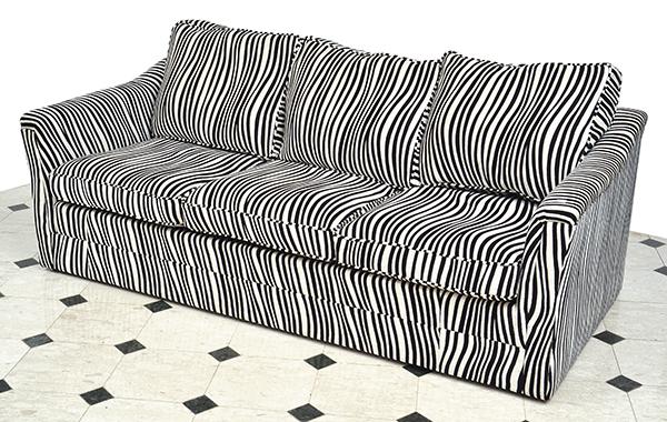 Appraisal: A CONTEMPORARY THREE SEAT SOFA UPHOLSTERED IN ZEBRA STRIPE FABRIC