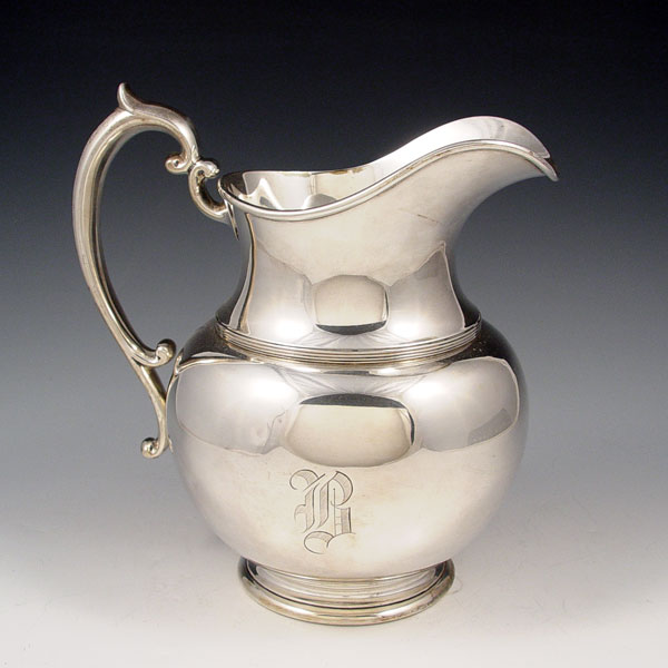 Appraisal: DURGIN STERLING PINT WATER PITCHER Applied scroll handle footed base