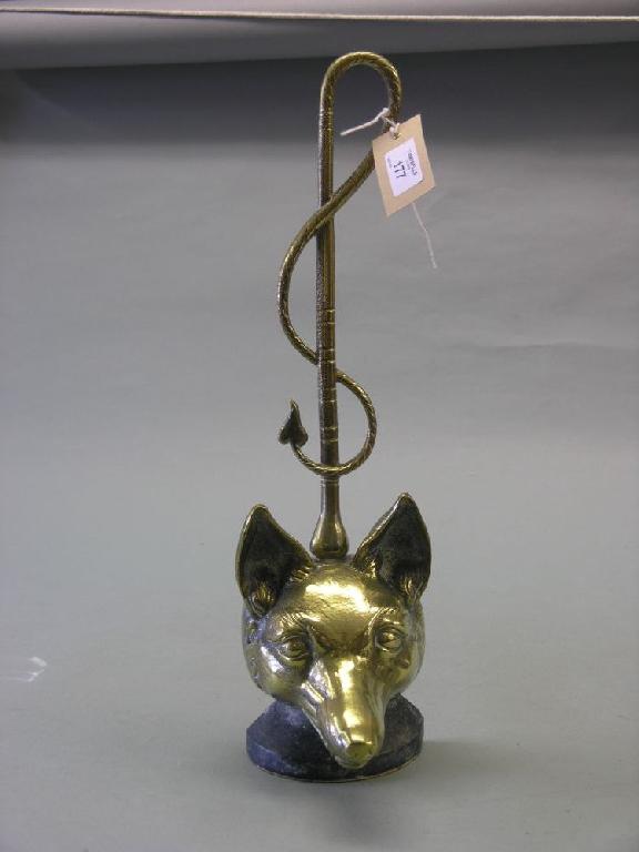 Appraisal: A Victorian brass fox-head door stop in high