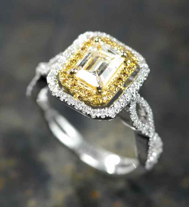 Appraisal: DIAMOND AND EIGHTEEN KARAT GOLD RING The two-tone yellow and