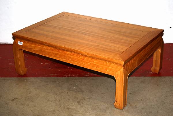 Appraisal: A Chinese style blonde wood coffee table Formed with a