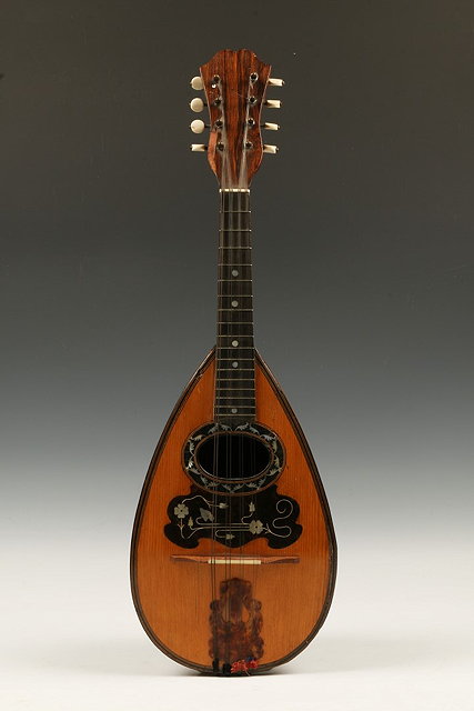 Appraisal: AN ITALIAN ROSEWOOD BACKED MANDOLIN with decorative mother of pearl