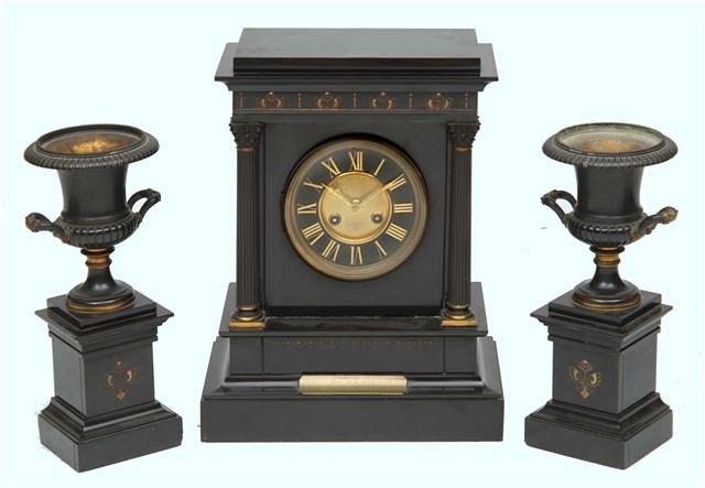 Appraisal: A VICTORIAN BLACK SLATE PRESENTATION CLOCK GARNITURE consisting of a