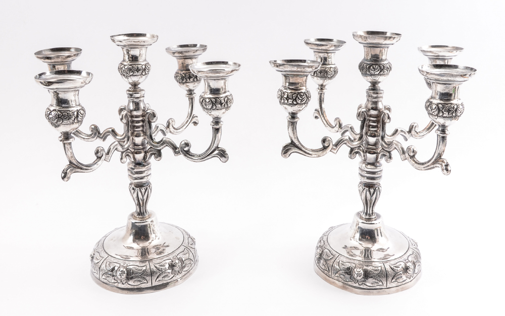 Appraisal: PAIR STERLING SILVER CANDLESTICKS light candelabra with embossed floral motifs