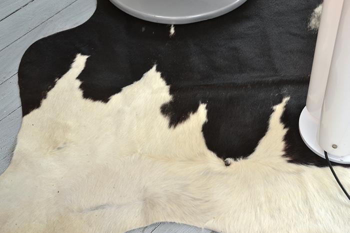 Appraisal: BLACK AND WHITE COWHIDE Approximately cm wide BLACK AND WHITE