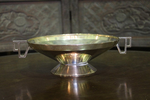 Appraisal: AN OPEN SILVER BOWL of pedestal form with stylised lug