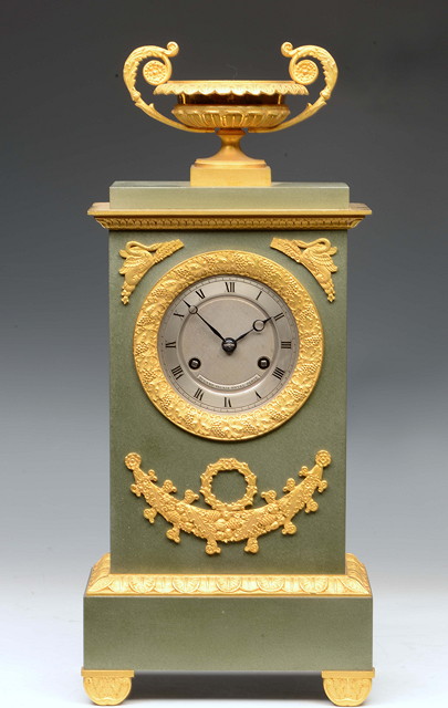 Appraisal: A FRENCH EMPIRE MANTEL CLOCK the silvered Roman dial with