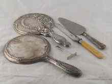 Appraisal: Two silver hand mirrors a silver handled cake slice a