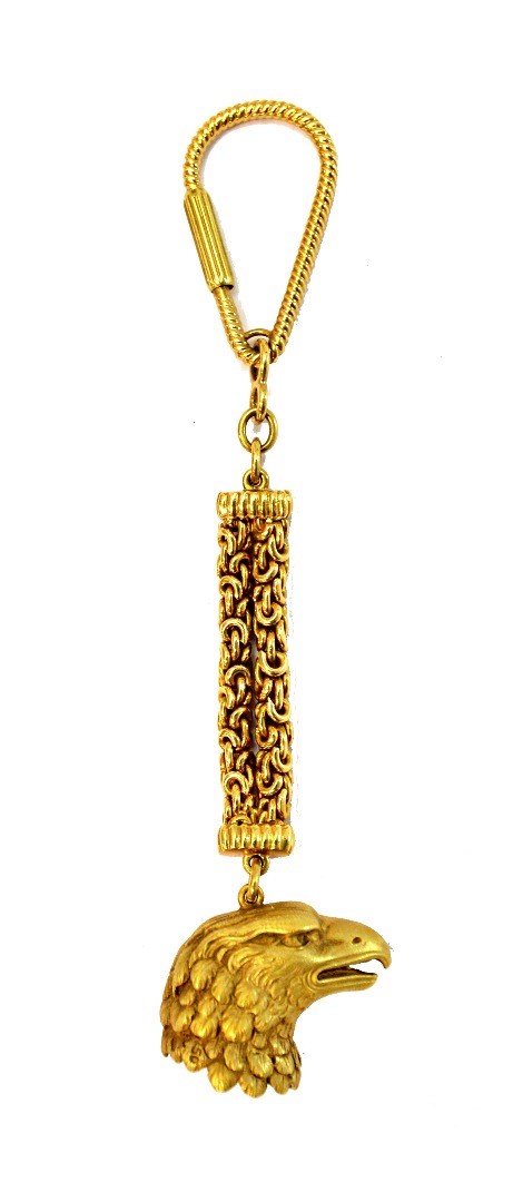 Appraisal: A gold keyring the terminal designed as the head of