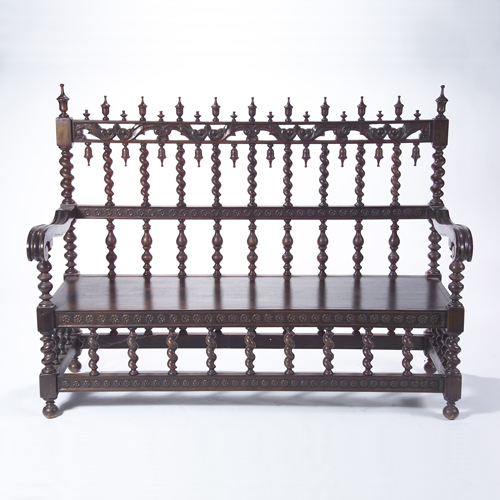 Appraisal: Spanish Baroque style black walnut settee with turned spindle back