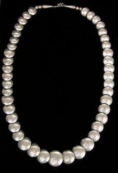 Appraisal: An Unusual Silver Disk Bead Necklace A long strand of