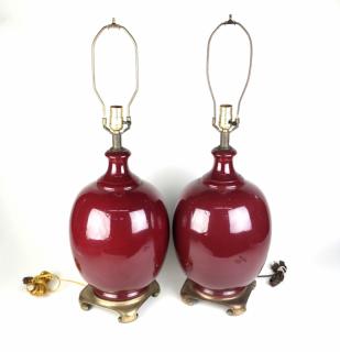 Appraisal: Pair Of Oxblood Porcelain Lamps Pair of oxblood porcelain lamps