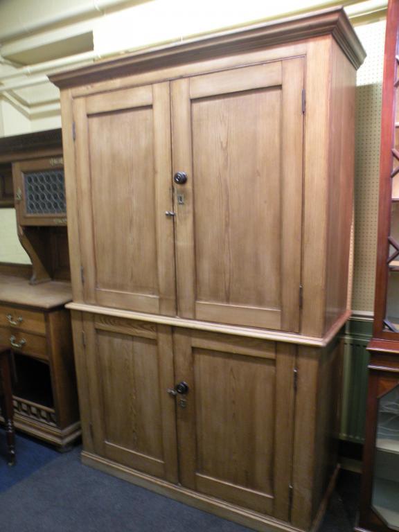 Appraisal: A Victorian pine housekeeper's type cupboard the top with a