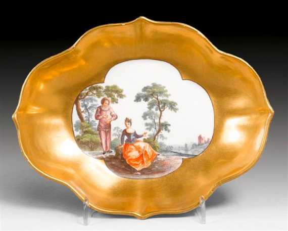 Appraisal: QUATREFOIL-SHAPED SOUCOUPE WITH WATTEAU SCENE Meissen circa The outer side