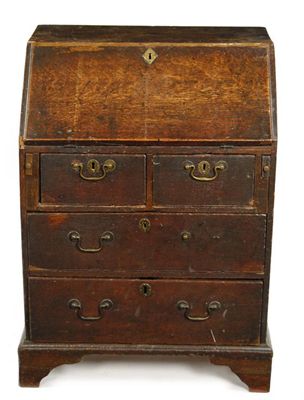 Appraisal: An th century oak small bureau with a hinged moulded