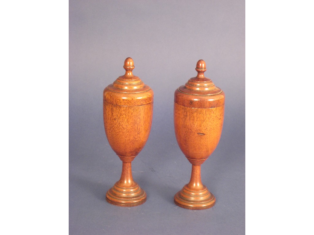 Appraisal: A pair of Treen Cups and Covers on pedestal bases