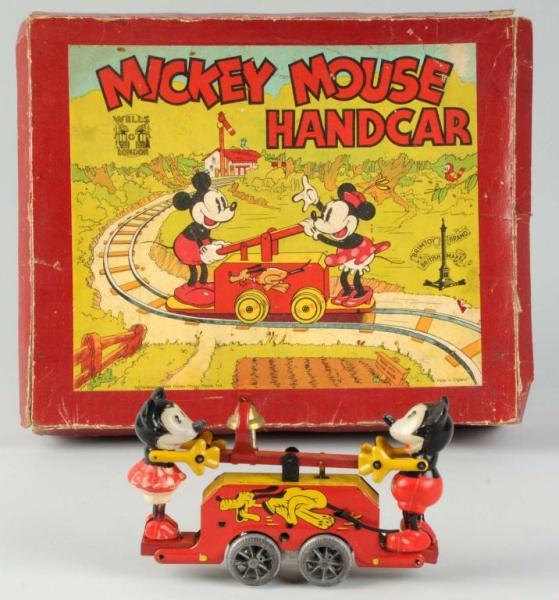 Appraisal: Wells Wind-Up Mickey Minnie Mouse Handcar Toy Description England Working