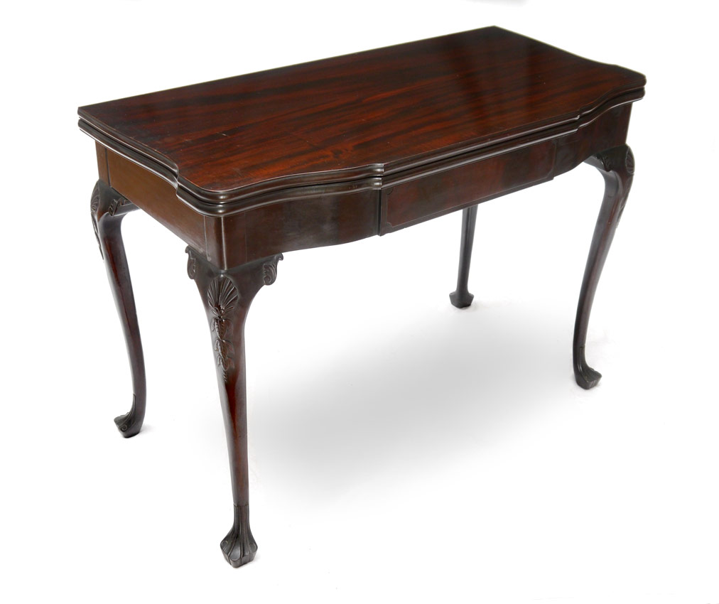 Appraisal: CHIPPENDALE CARVED MAHOGANY EXTENSION GAME TABLE WITH LEAVES Shaped flip