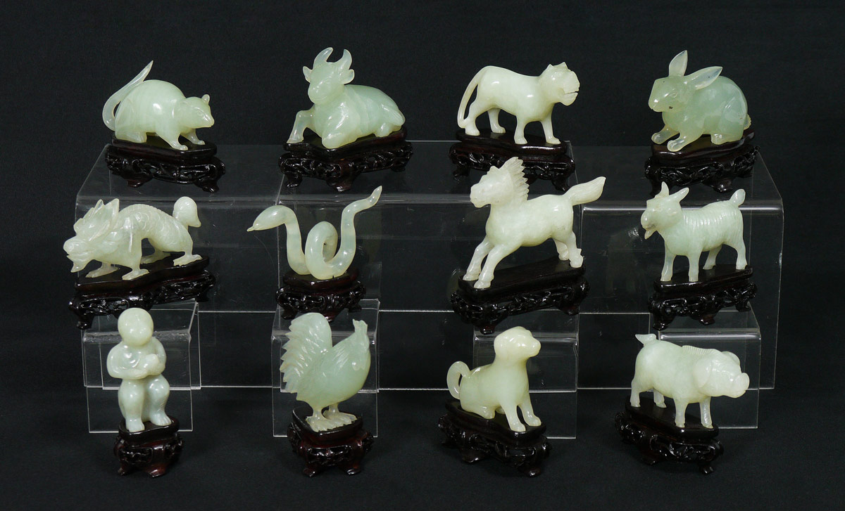 Appraisal: CHINESE STONE ZODIAC FIGURES IN CASE Complete set of figures