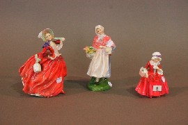 Appraisal: Three Royal Doulton figures 'Autumn Breezes' 'Market Day' and 'Lavinia'