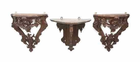 Appraisal: A Pair of Continental Carved Walnut Wall Brackets each with