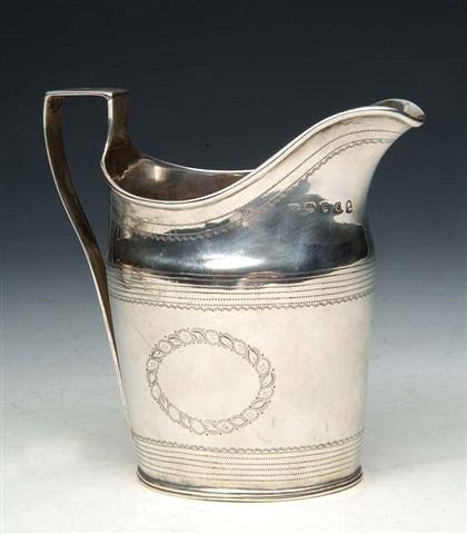 Appraisal: A GEORGE III SILVER HELMET JUG with prick engraved decoration