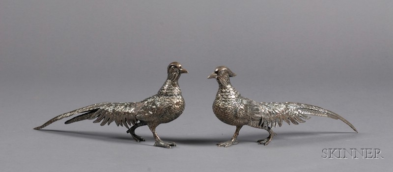 Appraisal: Pair of Peruvian Sterling Pheasant-form Ornamental Casters th century formed