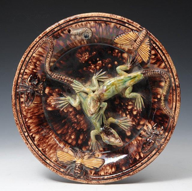 Appraisal: A PORTUGUESE PALISSY STYLE CHARGER the tortoiseshell glazed ground applied