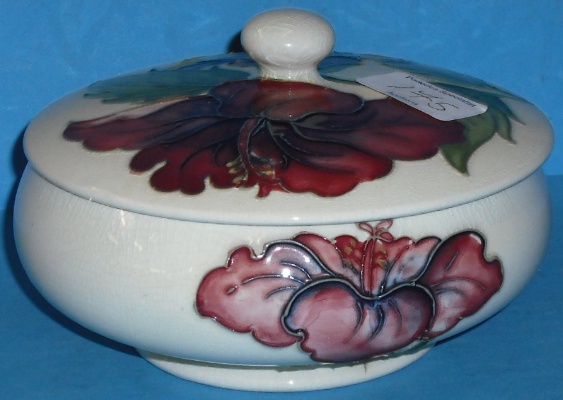 Appraisal: Moorcroft round box cover decorated in the Hibiscus design on