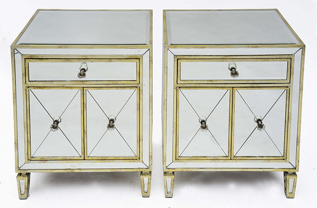 Appraisal: A PAIR OF MIRRORED AND PARCEL GILT BEDSIDE CABINETS each