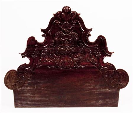 Appraisal: A th century carved oak French Provincial bedhead of shaped