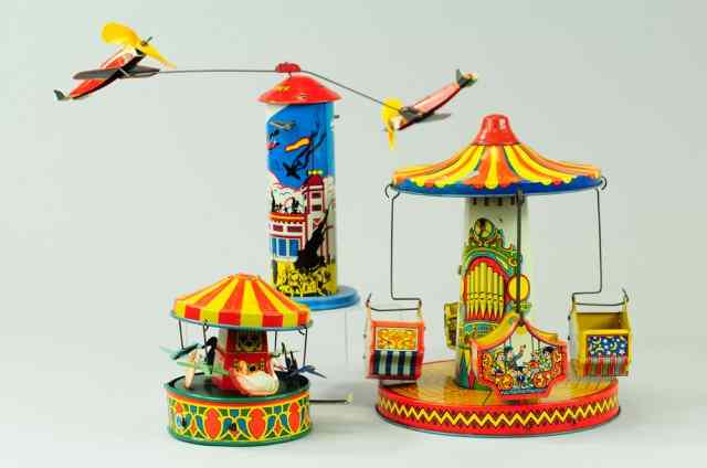 Appraisal: MERRY-GO-ROUNDS AND SKY HAWK Lithographed tin colorful graphics features four