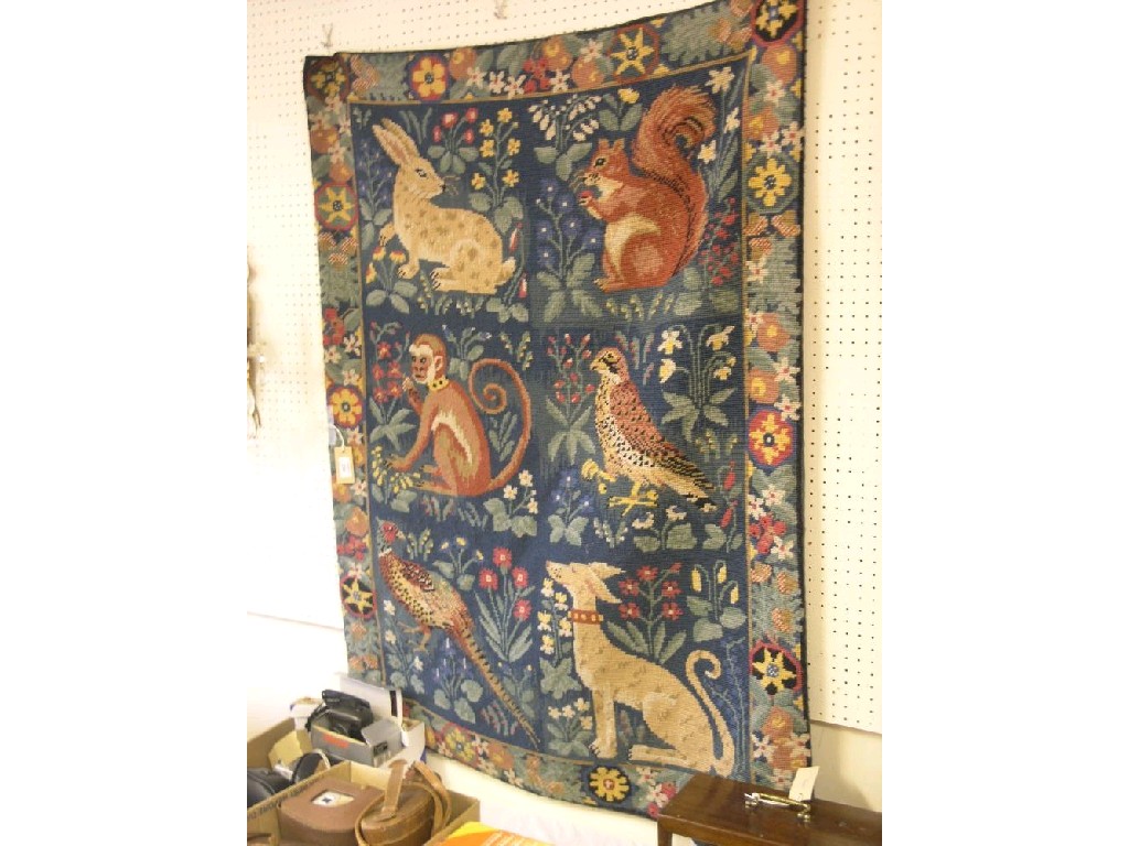 Appraisal: A needlework wall-hanging hand worked with a squirrel rabbit monkey