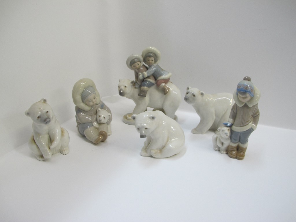 Appraisal: Three Lladro groups of Eskimo children and three others of