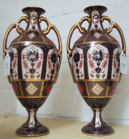 Appraisal: A pair of Royal Crown Derby two handle vases last