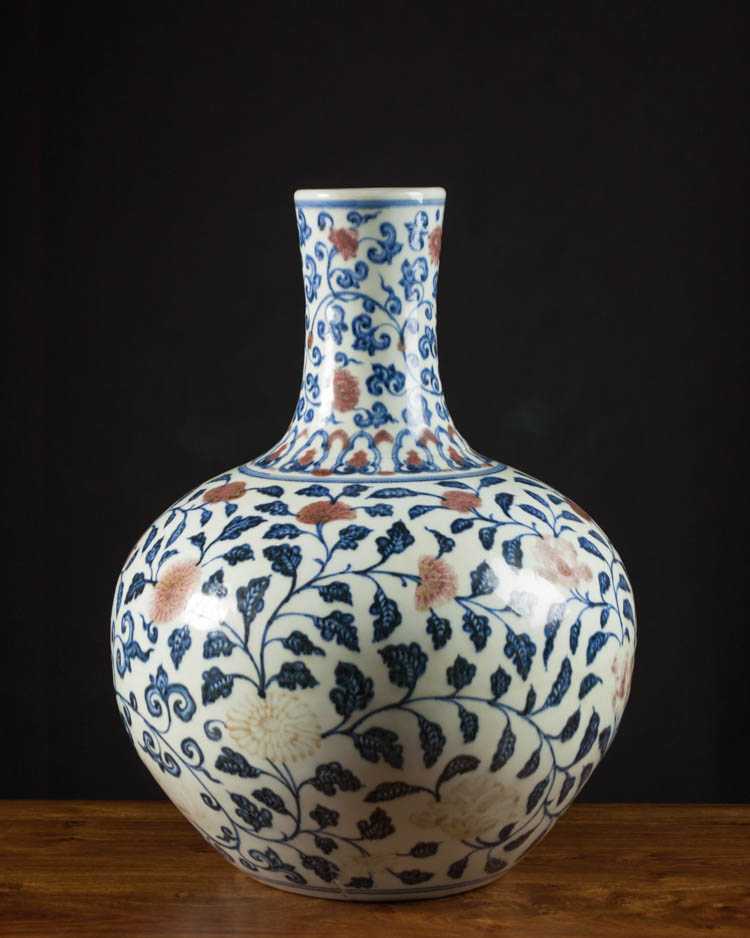 Appraisal: CHINESE BLUE AND IRON RED PORCELAIN VASE of bottle form