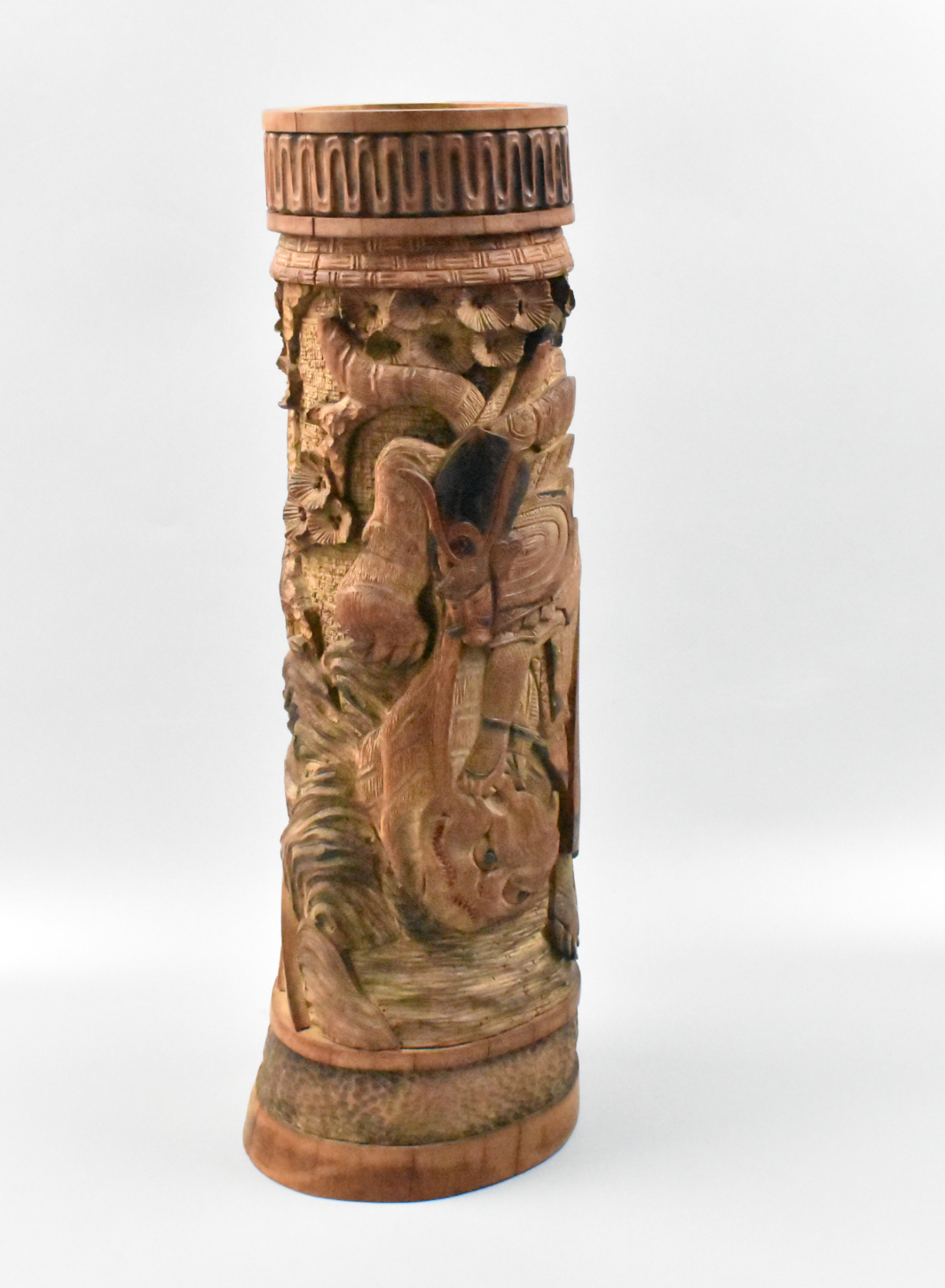 Appraisal: A Japanese carved bamboo vase featuring a Samurai warrior Meiji