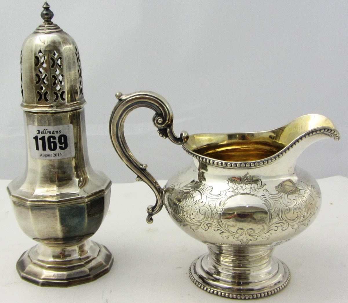 Appraisal: A silver sugar caster of faceted baluster form Birmingham and