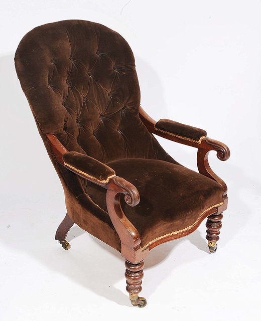 Appraisal: AN EARLY VICTORIAN MAHOGANY FRAMED BUTTON BACKED DRAYLON UPHOLSTERED ARMCHAIR