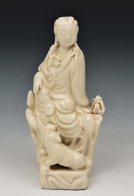 Appraisal: A Chinese blanc de chine model of Guanyin with temple