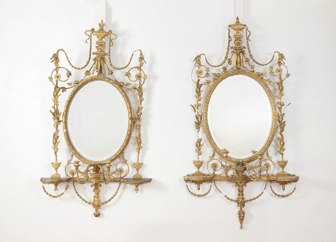 Appraisal: PAIR OF ADAMS STYLE CARVED GILTWOOD PARLOR MIRRORS Nicely detailed