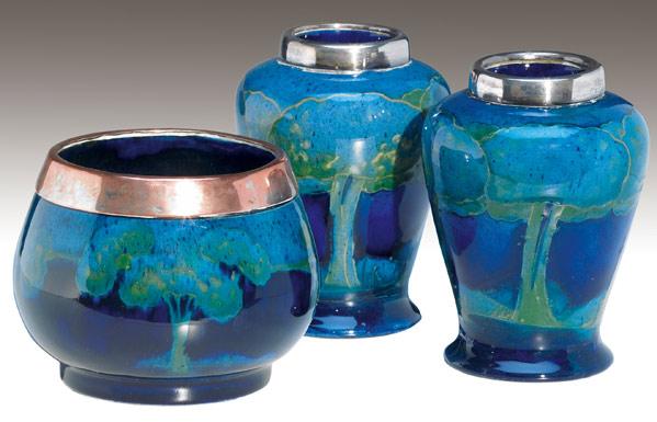 Appraisal: MOORCROFT Three cabinet vases in the Eventide design with silver