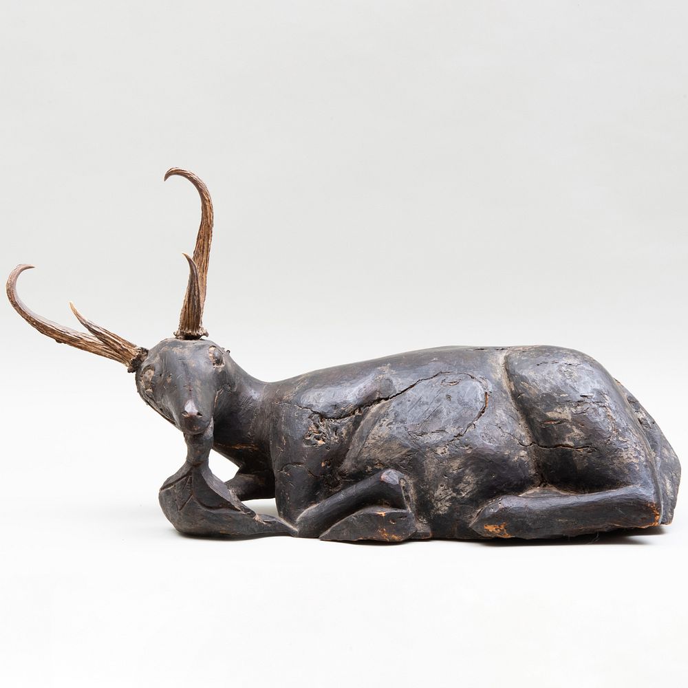 Appraisal: Horn Mounted Carved and Painted Figure of a Recumbent Stag