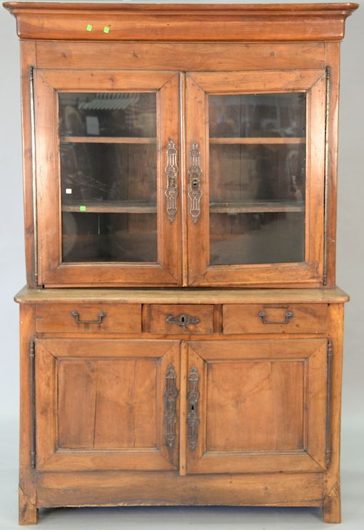 Appraisal: Continental three part cupboard feet ended out ht in wd