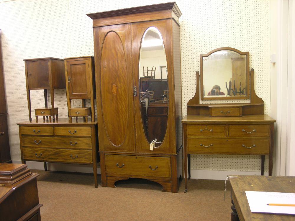 Appraisal: A composite Edwardian inlaid mahogany bedroom suite consisting of wardrobe