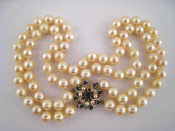 Appraisal: A two row cultured pearl necklace with white and yellow