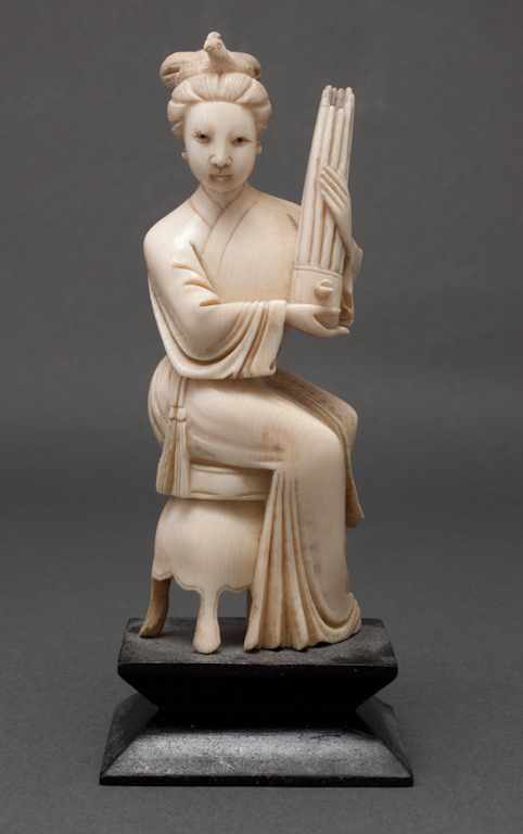 Appraisal: Chinese carved ivory figure of seated woman on ebonized wood