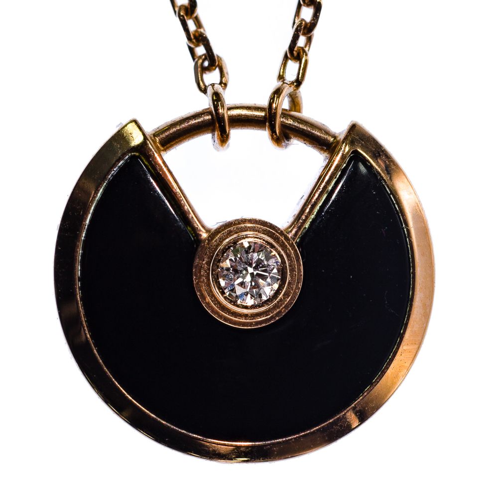 Appraisal: CARTIER K ROSE GOLD ONYX AND DIAMOND AMULETTE DE CARTIER